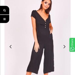 NWT black jumper with buttons and open back